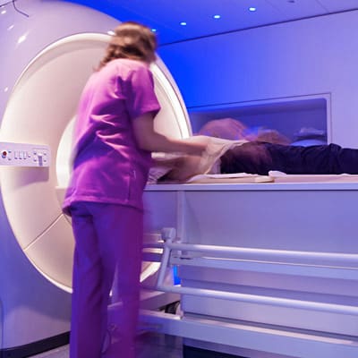 Person on MRI Scanner with doctor